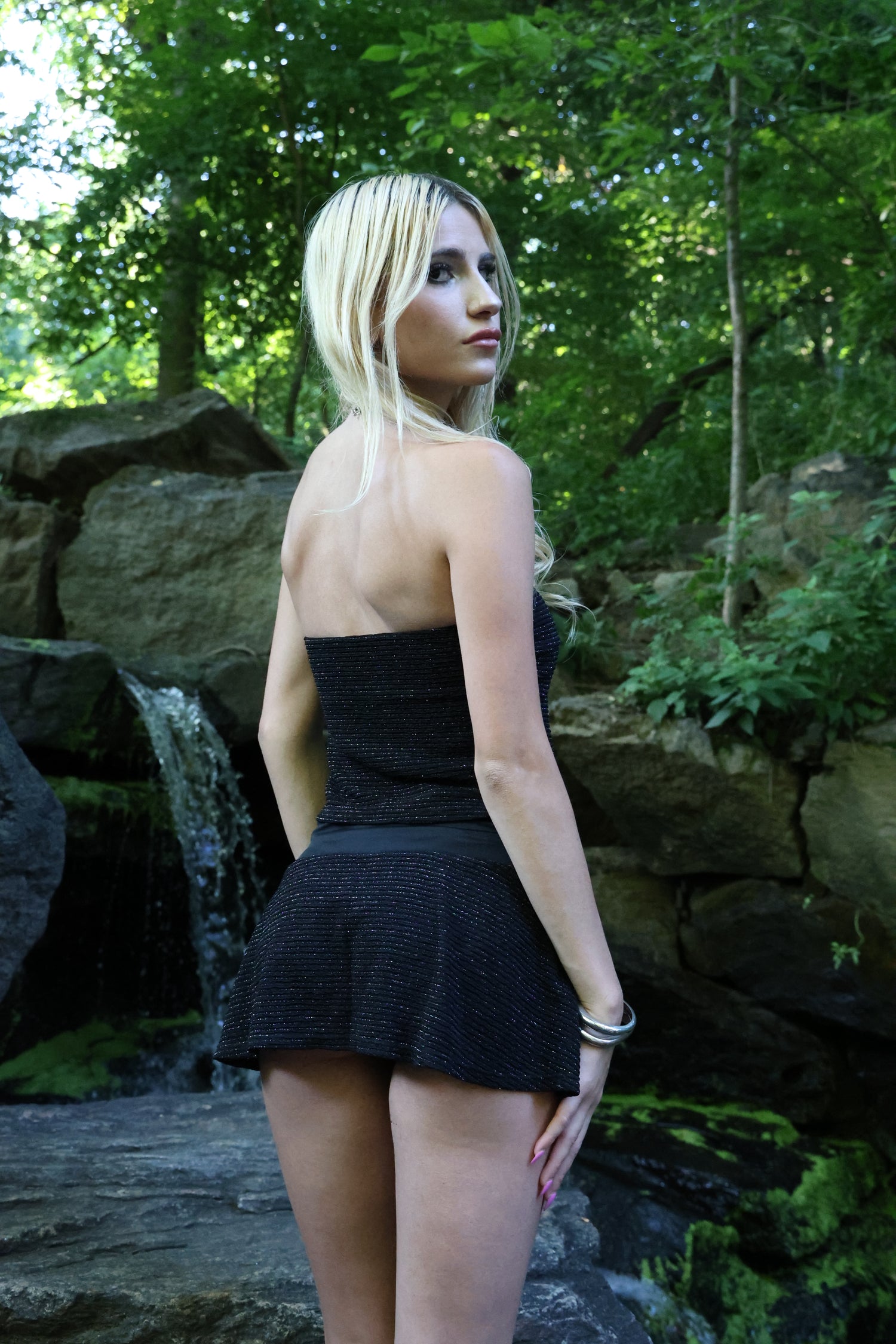 Back view of the Molly Tube Swim Top and Ariella Drop Waist Mini Swim Skirt in Black & Silver Stripe, showcasing comfortable full coverage, a secure fit, and premium quick-drying recycled fabric.